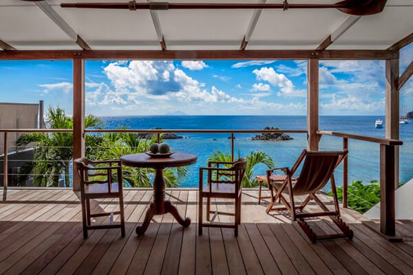 Relax and enjoy views of the Ocean from the deck at Gustavia Hill Villa